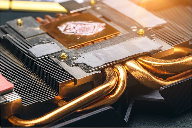 Close-up of a computer processor with heat pipes and cooling components