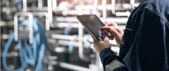 man holding a tablet